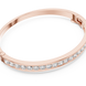Channel set lab grown diamond bangle bracelet in yellow gold white gold and rose gold with sleek round diamond design