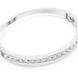 Channel set lab grown diamond bangle bracelet in yellow gold white gold and rose gold with sleek round diamond design