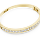 Channel set lab grown diamond bangle bracelet in yellow gold white gold and rose gold with sleek round diamond design