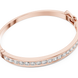 Rose gold bracelet with clear stones on a white background