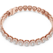 Gold bracelet with diamond accents on a white background