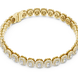 Gold bracelet with diamond accents on a white background