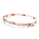 Twisted lab grown diamond bangle bracelet in yellow gold white gold and rose gold with modern crossover diamond design