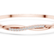 Twisted lab grown diamond bangle bracelet in yellow gold white gold and rose gold with modern crossover diamond design