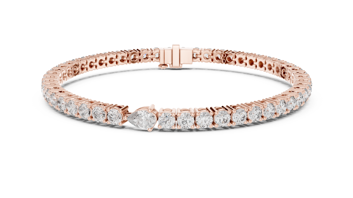 Pear accent lab grown diamond tennis bracelet with round diamonds and central pear cut diamond in gold variations