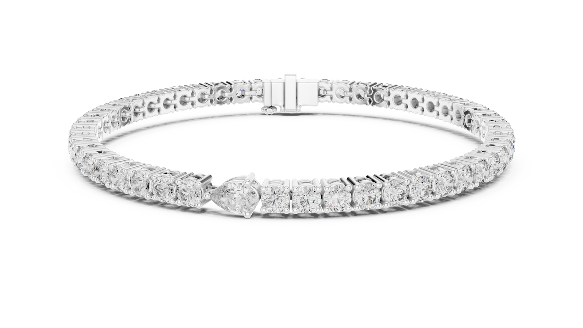 Pear accent lab grown diamond tennis bracelet with round diamonds and central pear cut diamond in gold variations