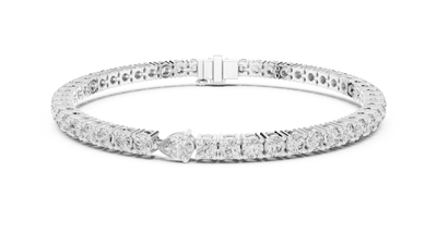 Pear accent lab grown diamond tennis bracelet with round diamonds and central pear cut diamond in gold variations