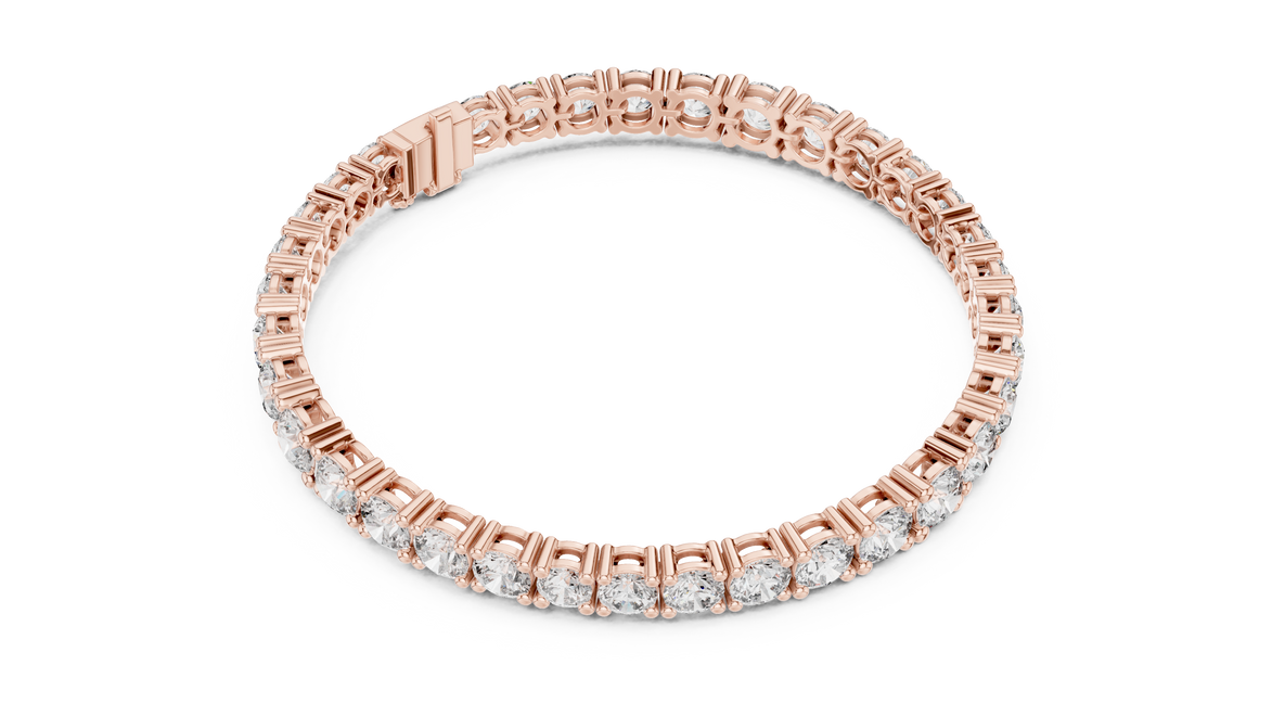 Graduated lab grown diamond tennis bracelet with varying size round diamonds in yellow white and rose gold