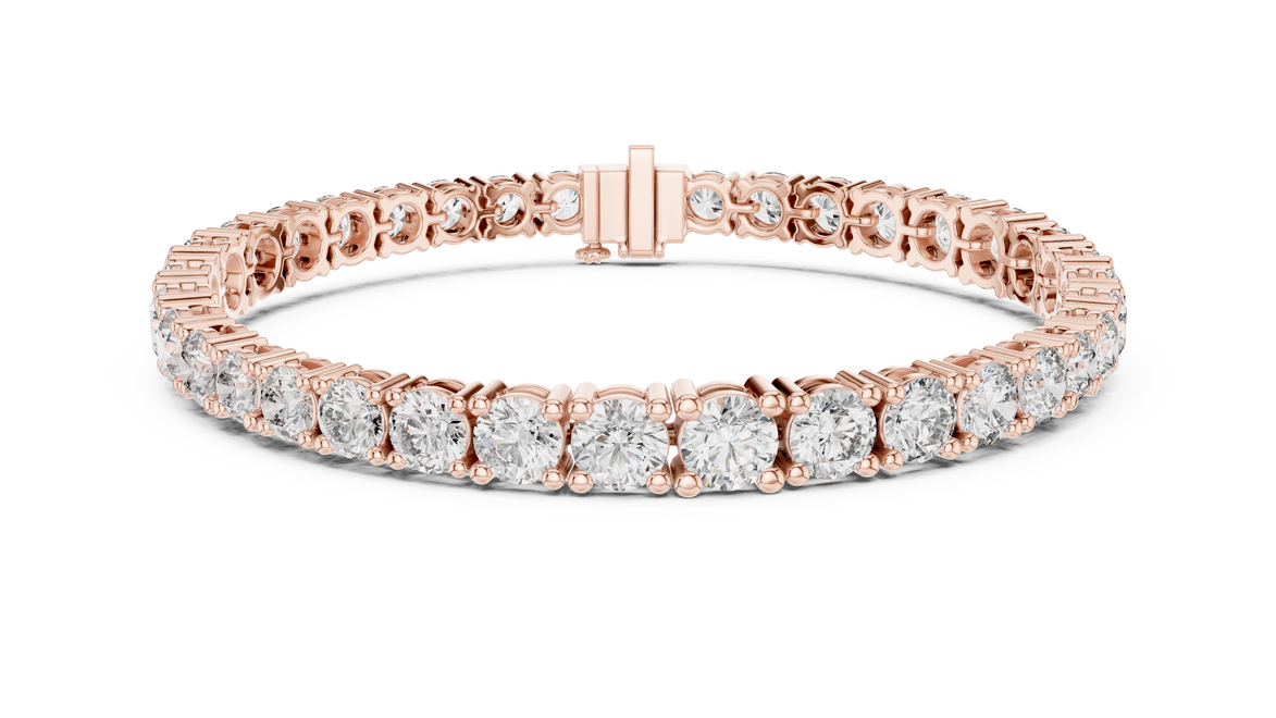 Graduated lab grown diamond tennis bracelet with varying size round diamonds in yellow white and rose gold