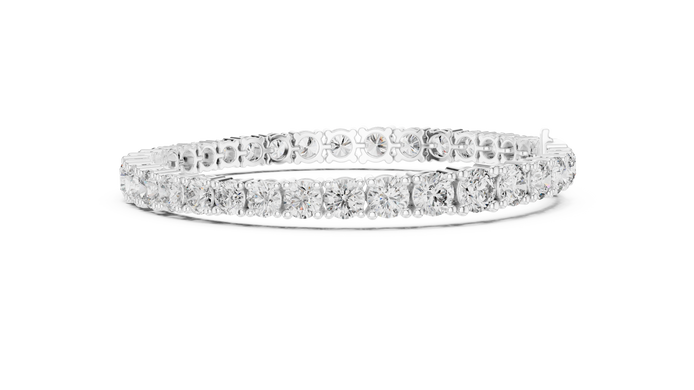 Graduated lab grown diamond tennis bracelet with varying size round diamonds in yellow white and rose gold