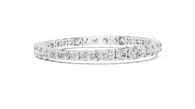 Graduated lab grown diamond tennis bracelet with varying size round diamonds in yellow white and rose gold