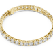 Graduated lab grown diamond tennis bracelet with varying size round diamonds in yellow white and rose gold