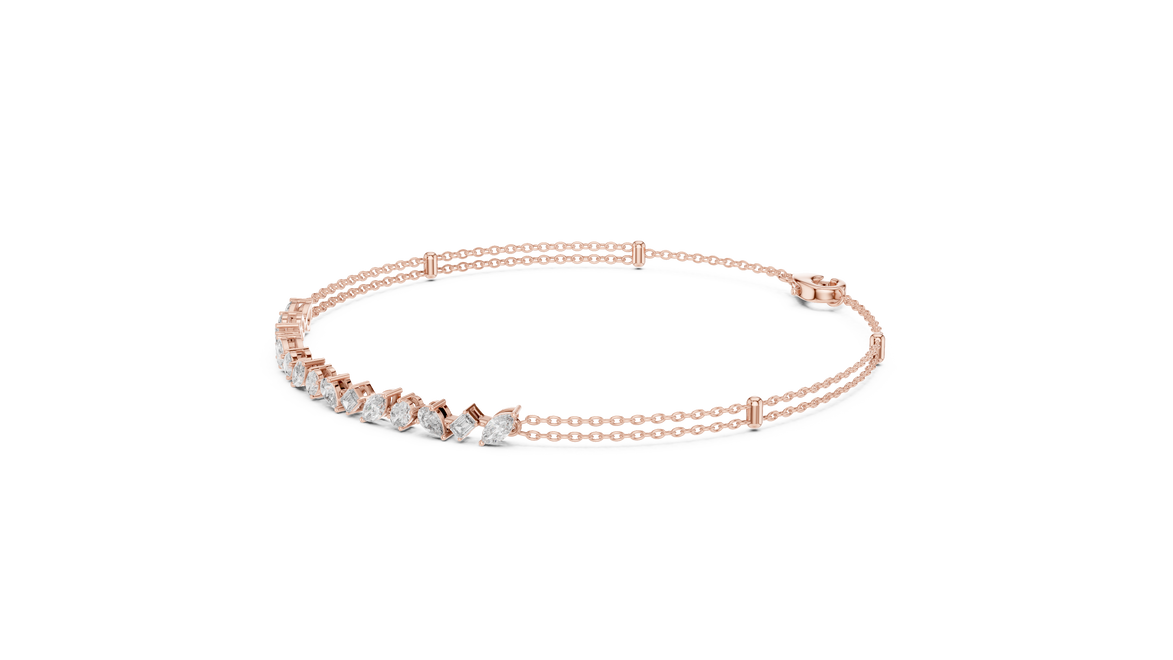 Contemporary multi shape lab grown diamond chain bracelet with pear oval marquise and emerald cut diamonds in yellow white and rose gold