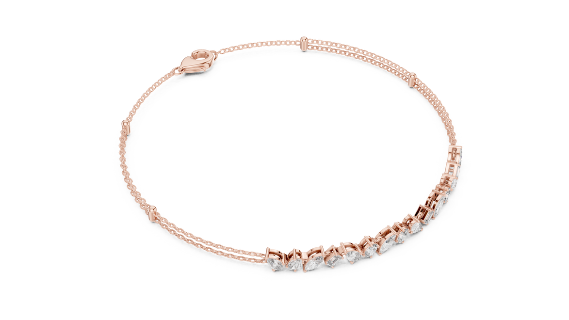 Contemporary multi shape lab grown diamond chain bracelet with pear oval marquise and emerald cut diamonds in yellow white and rose gold