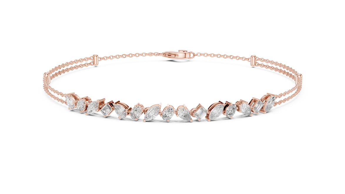 Contemporary multi shape lab grown diamond chain bracelet with pear oval marquise and emerald cut diamonds in yellow white and rose gold