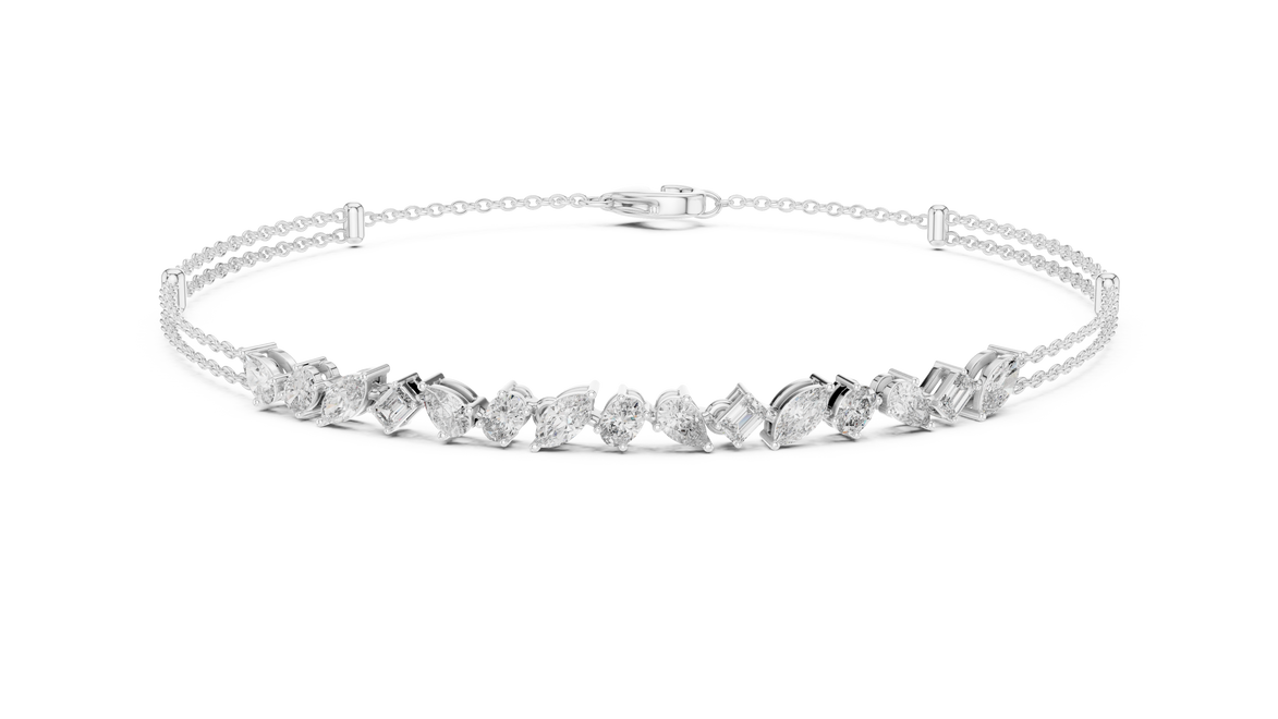Contemporary multi shape lab grown diamond chain bracelet with pear oval marquise and emerald cut diamonds in yellow white and rose gold