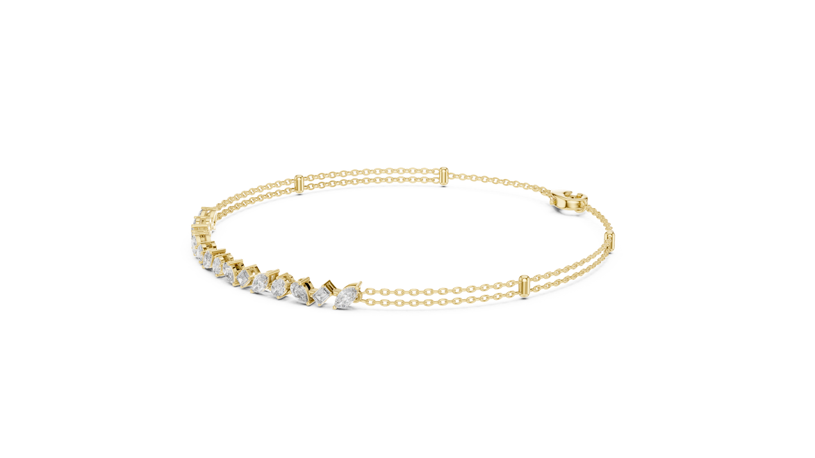 Contemporary multi shape lab grown diamond chain bracelet with pear oval marquise and emerald cut diamonds in yellow white and rose gold