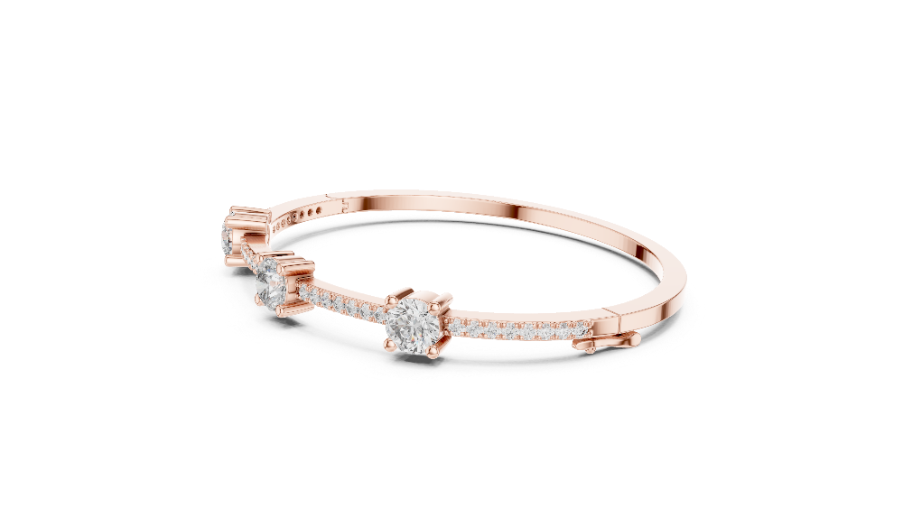 Elegant three stone round diamond bangle bracelet in gold with pavé accent diamonds by Signora Jewels