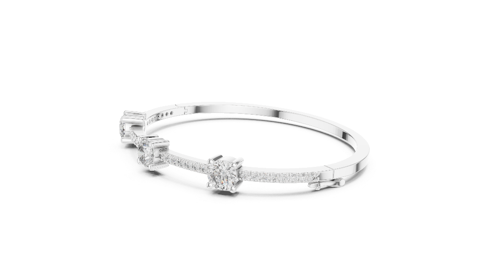 Elegant three stone round diamond bangle bracelet in gold with pavé accent diamonds by Signora Jewels