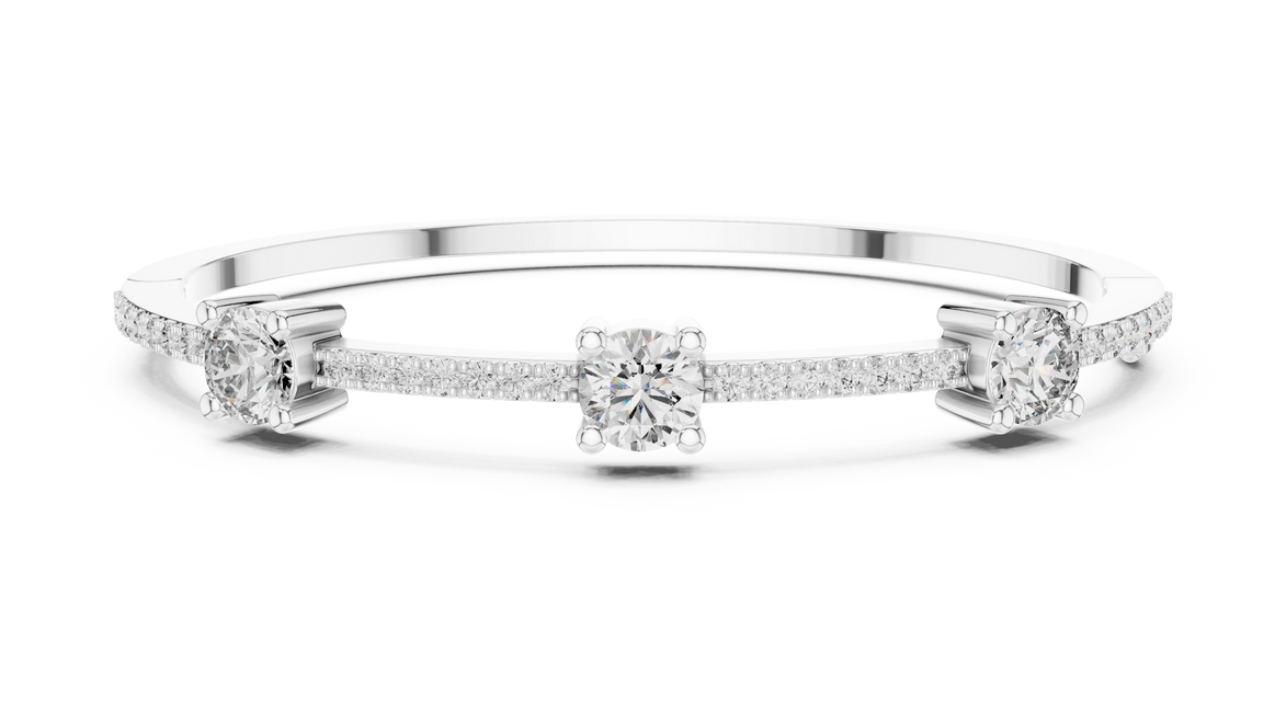 Elegant three stone round diamond bangle bracelet in gold with pavé accent diamonds by Signora Jewels
