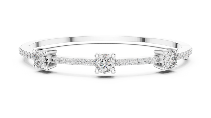 Elegant three stone round diamond bangle bracelet in gold with pavé accent diamonds by Signora Jewels