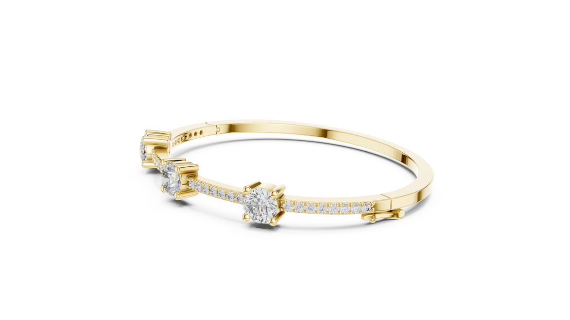 Elegant three stone round diamond bangle bracelet in gold with pavé accent diamonds by Signora Jewels
