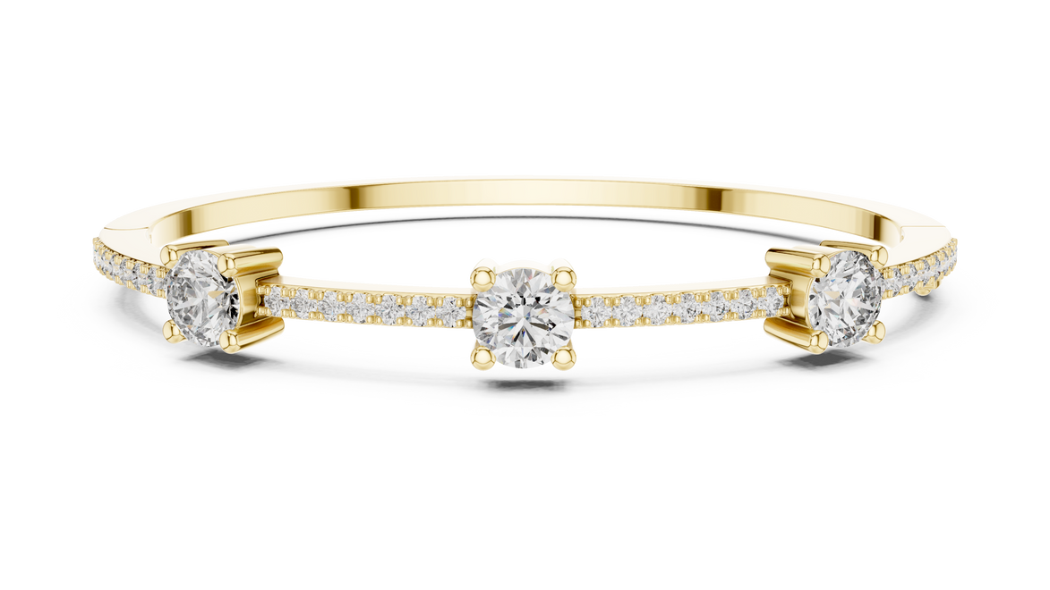 Elegant three stone round diamond bangle bracelet in gold with pavé accent diamonds by Signora Jewels