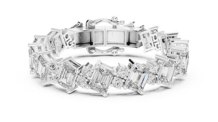 Luxury emerald cut diamond tennis bracelet in gold with round accent diamonds by Signora Jewels
