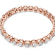 Rose gold bracelet with diamonds on a white background