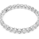 Silver ring with clear gemstones on a white background