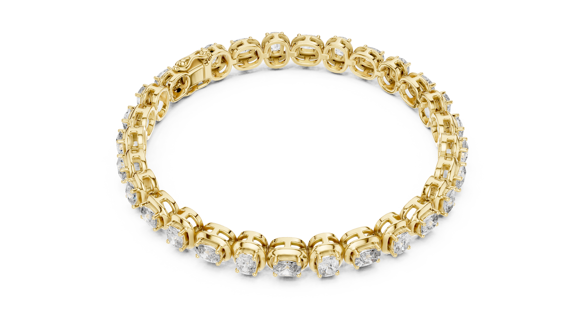 Gold bracelet with clear stones on a white background