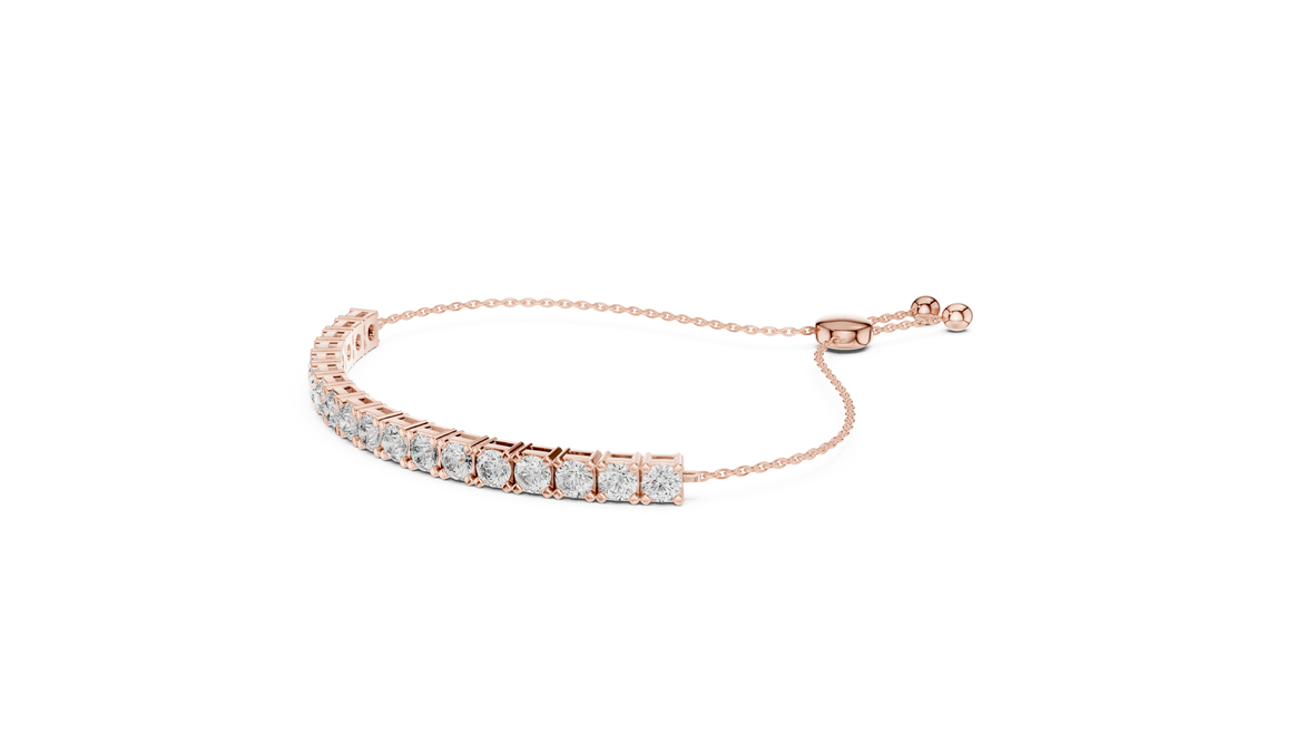 Gold bracelet with clear stones on a white background