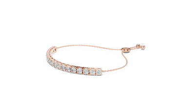 Gold bracelet with clear stones on a white background