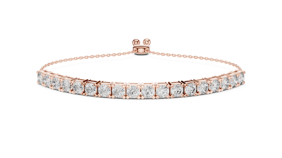 Rose gold bracelet with clear gemstones on a white background