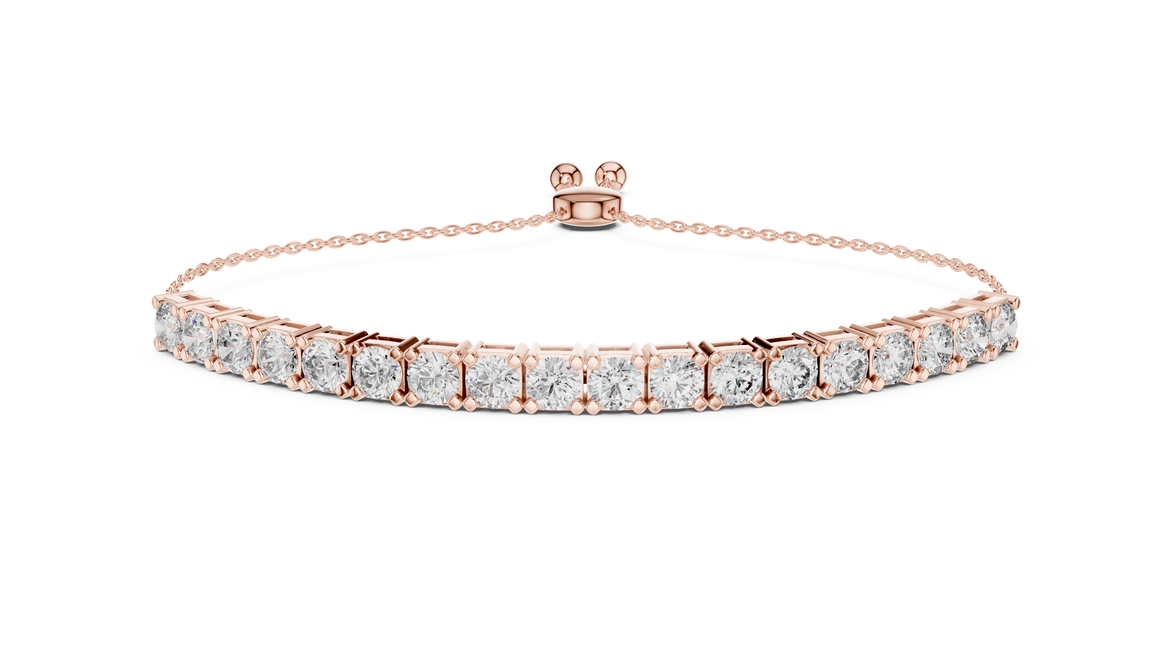 Rose gold bracelet with clear gemstones on a white background