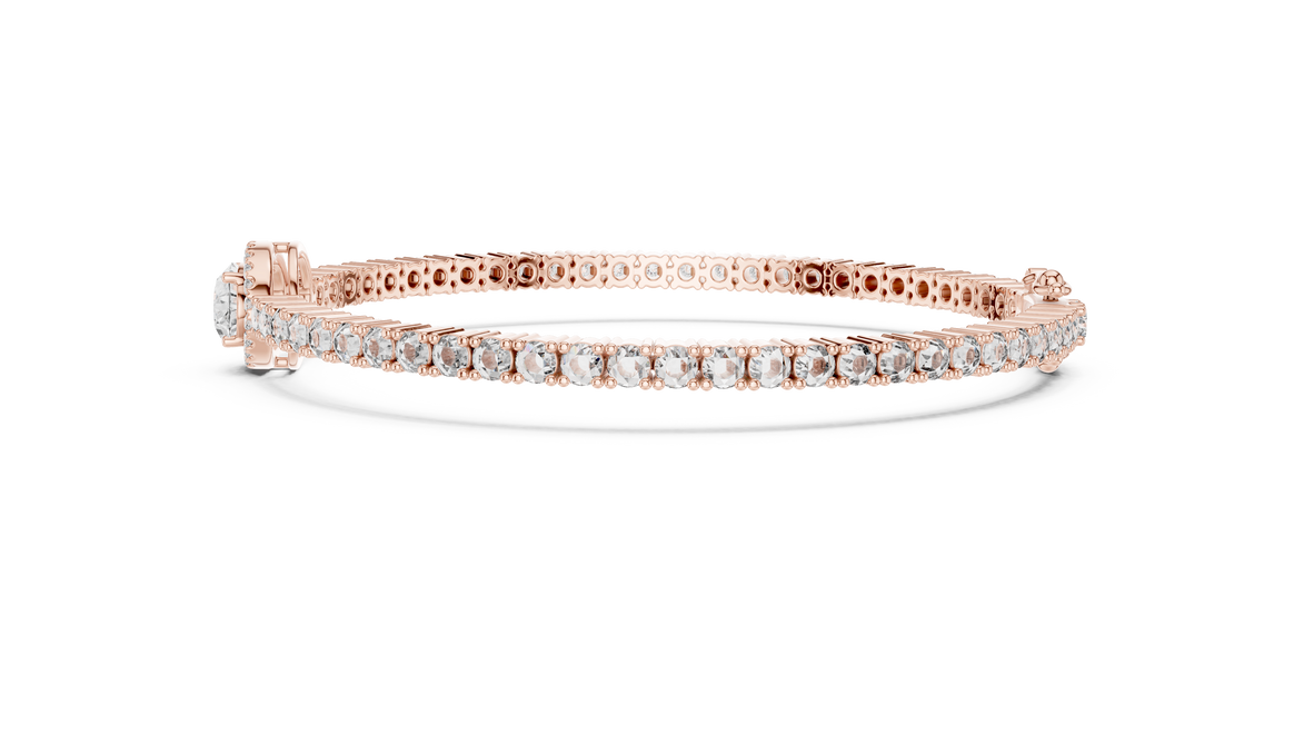 Rose gold bracelet with diamonds on a white background