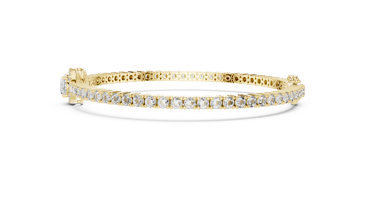 Gold bracelet with diamonds on a white background