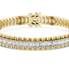 Gold bracelet with diamond accents on a white background