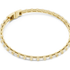 Gold bracelet with a white stone on a white background
