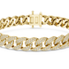 Gold chain bracelet with diamond accents on a white background