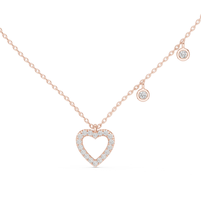 Gold necklace with a heart-shaped pendant on a white background