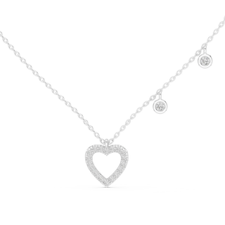 Gold necklace with a heart-shaped pendant on a white background