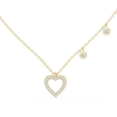 Gold necklace with a heart-shaped pendant on a white background