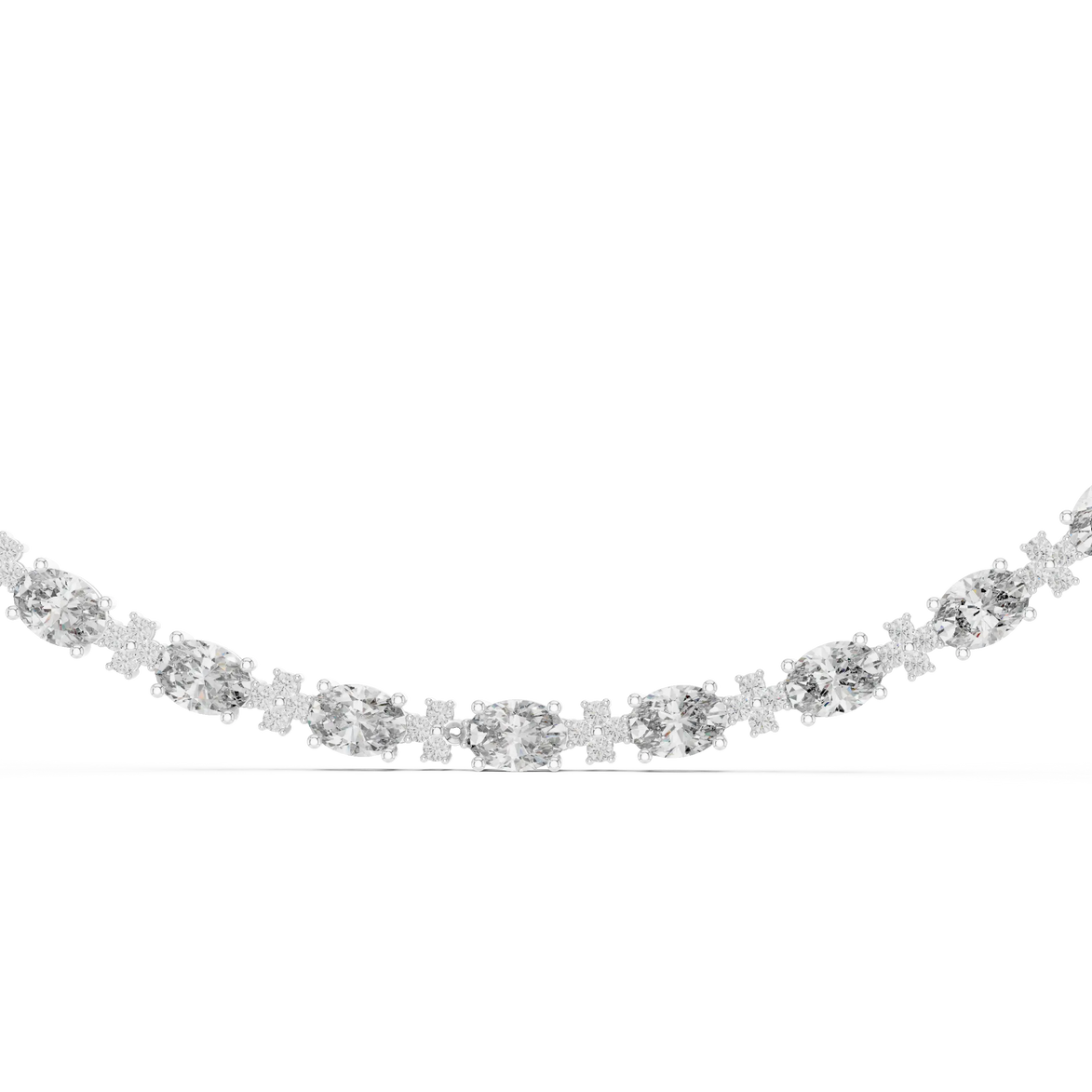 Silver necklace with clear stones on a white background