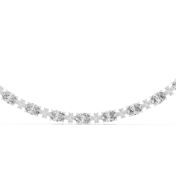 Silver necklace with clear stones on a white background