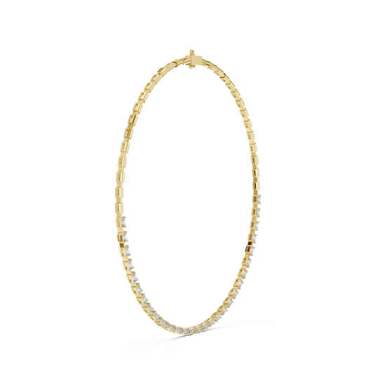 Gold necklace with small diamonds on a white background