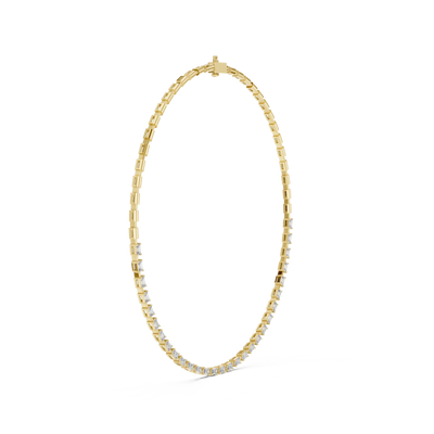 Gold necklace with small diamonds on a white background