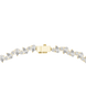 Gold bracelet with clear gemstones on a white background