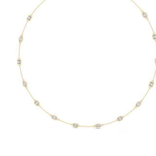 Gold necklace with small diamonds on a white background