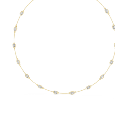 Gold necklace with small diamonds on a white background